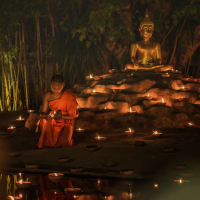 asalha-puja-day-,monks-light-candles